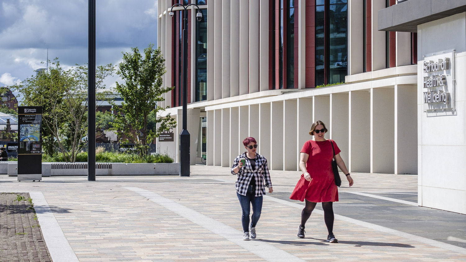 People walking in front of university building