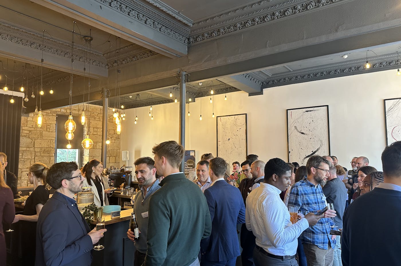 People standing in room having conversations