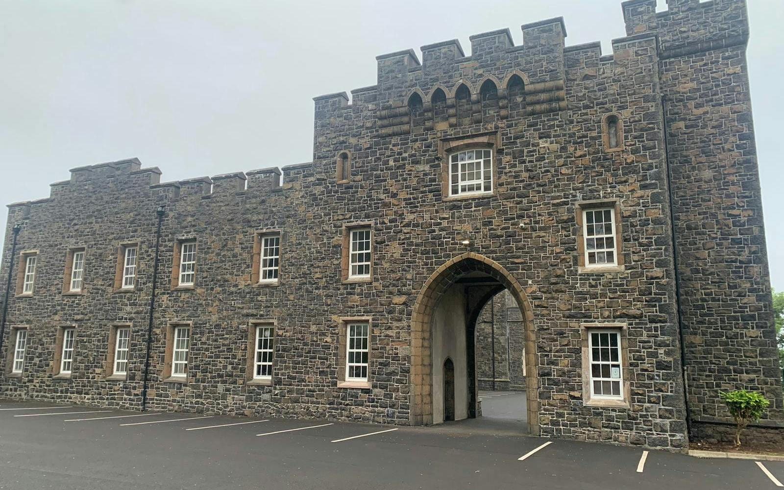a stone building with a large archway