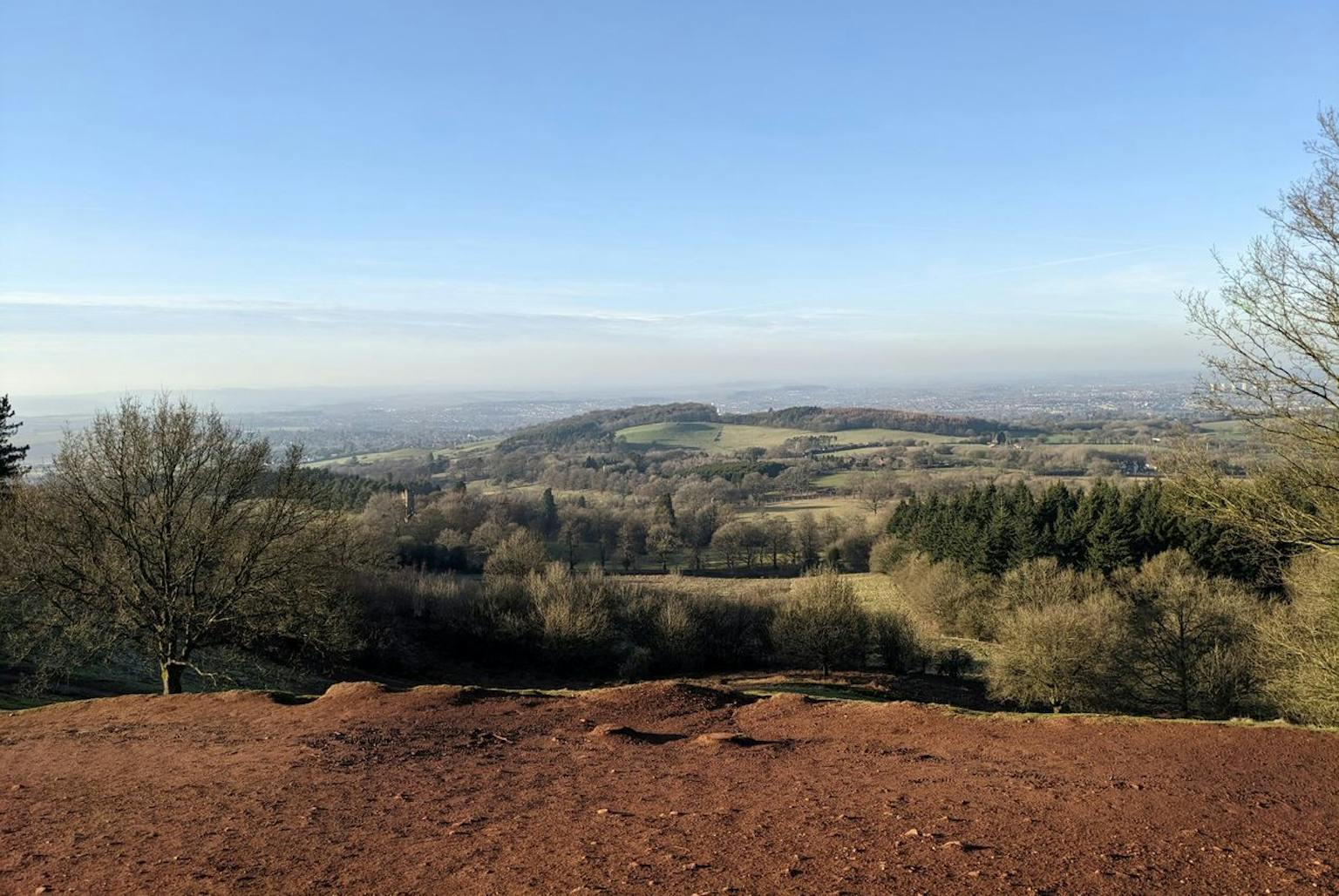 Panoramic view of a scenic landscape from the top of a hill