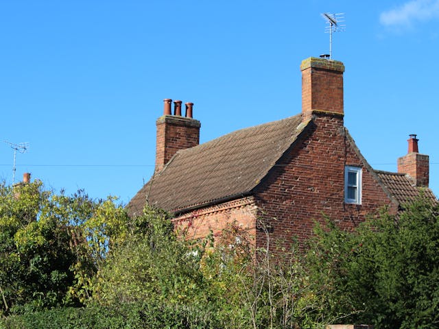 a brick house with a chimney