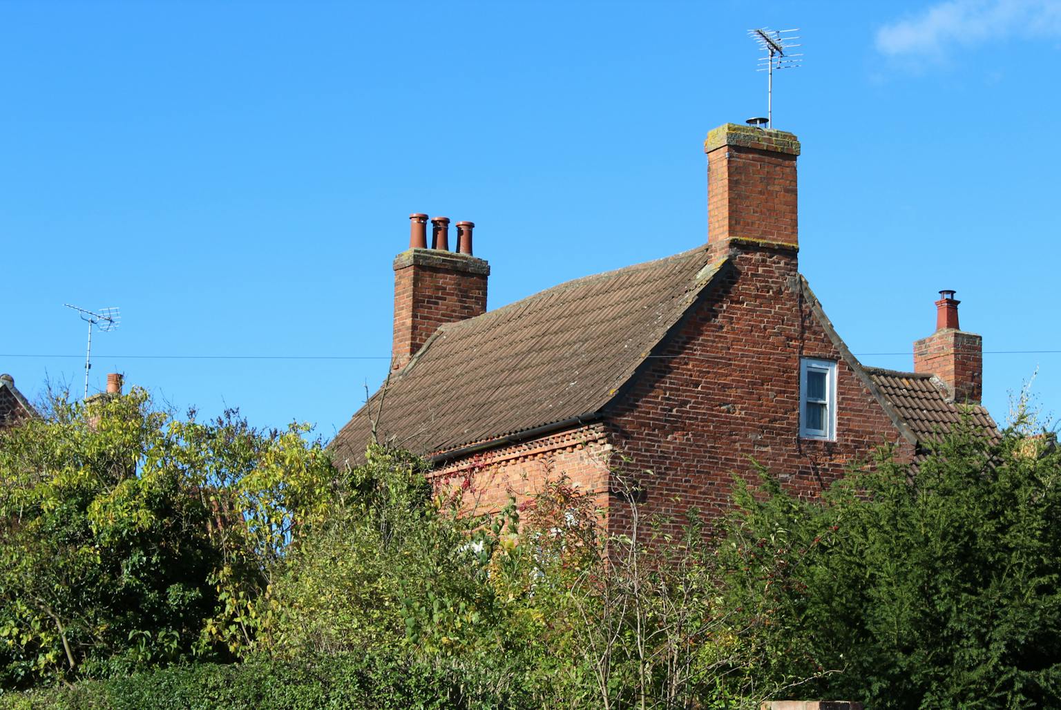 a brick house with a chimney