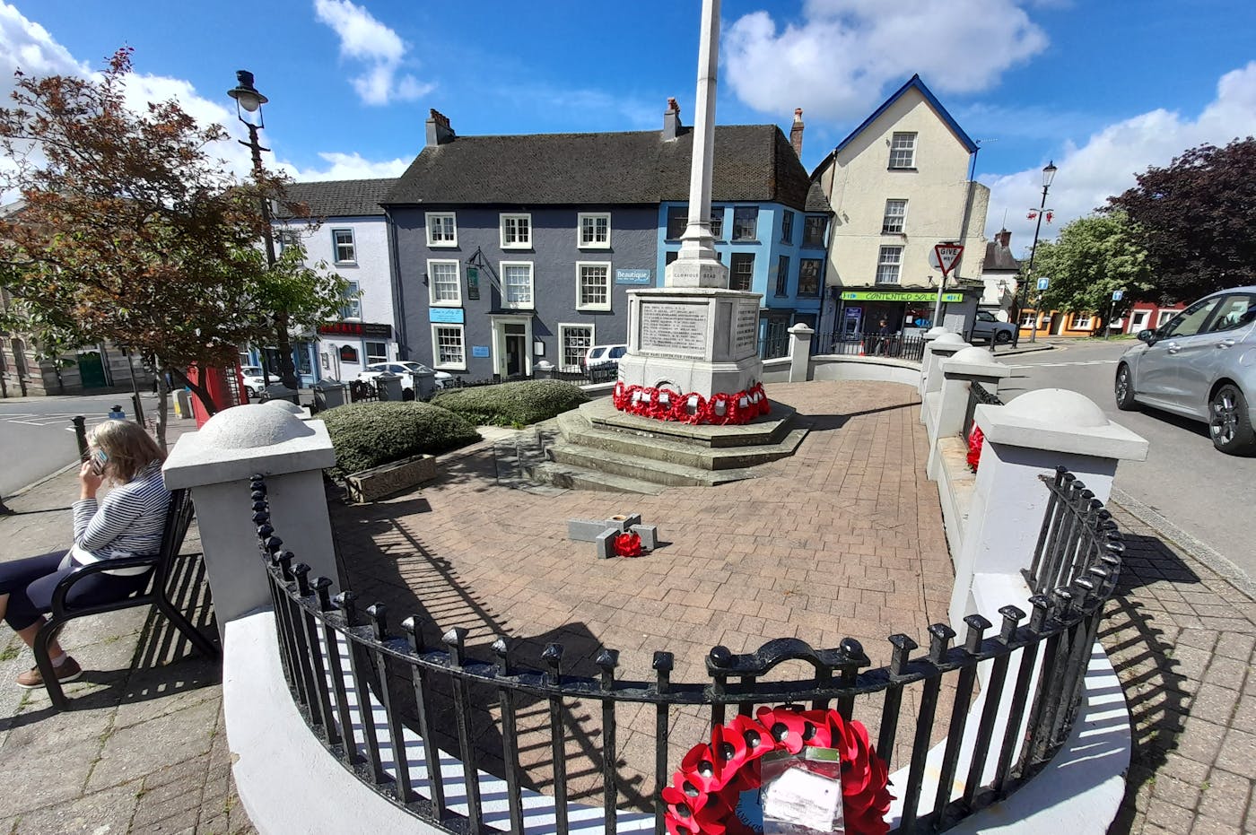 a monument with a flag in the middle of a town