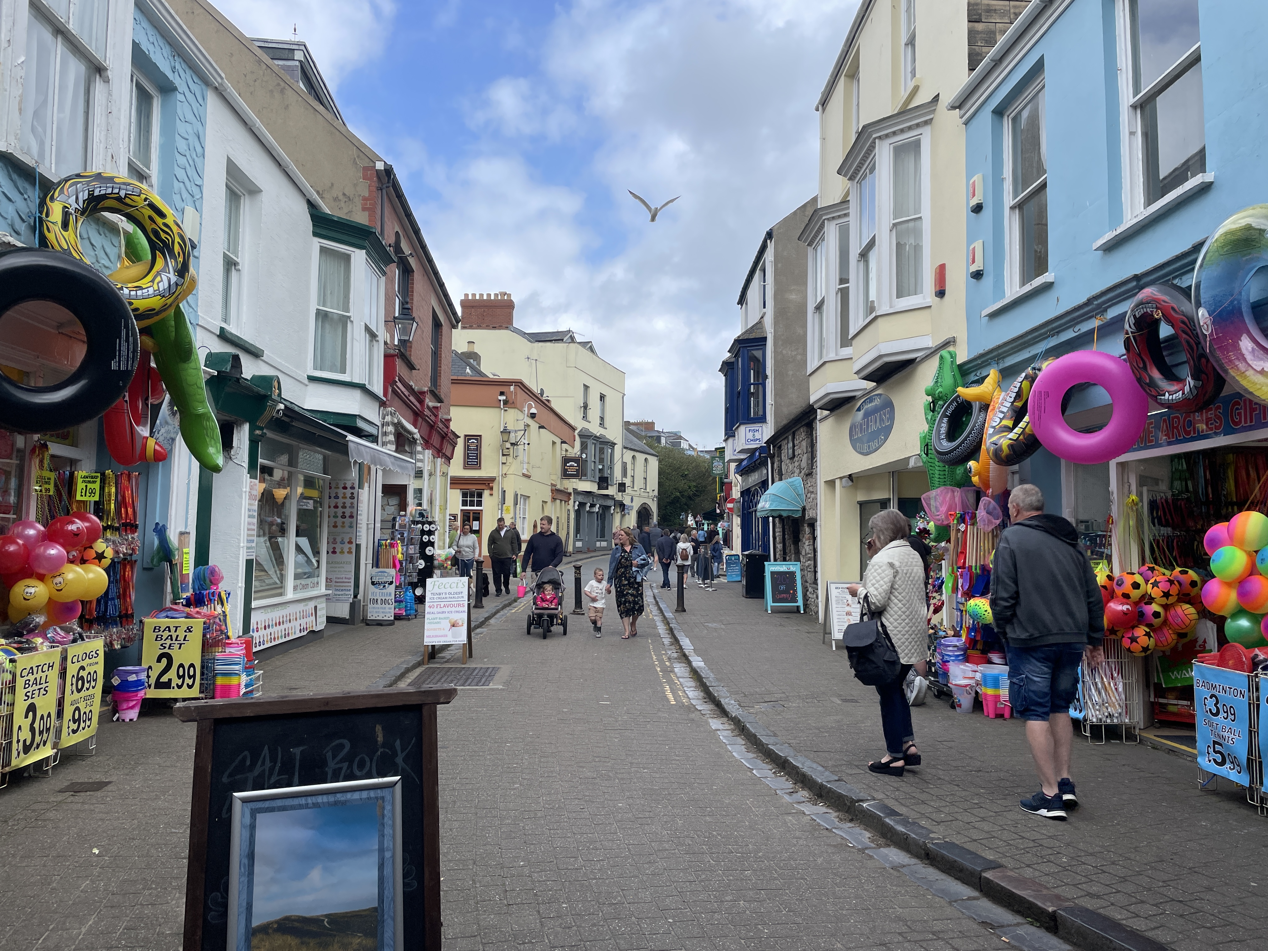 a street with people walking down it
