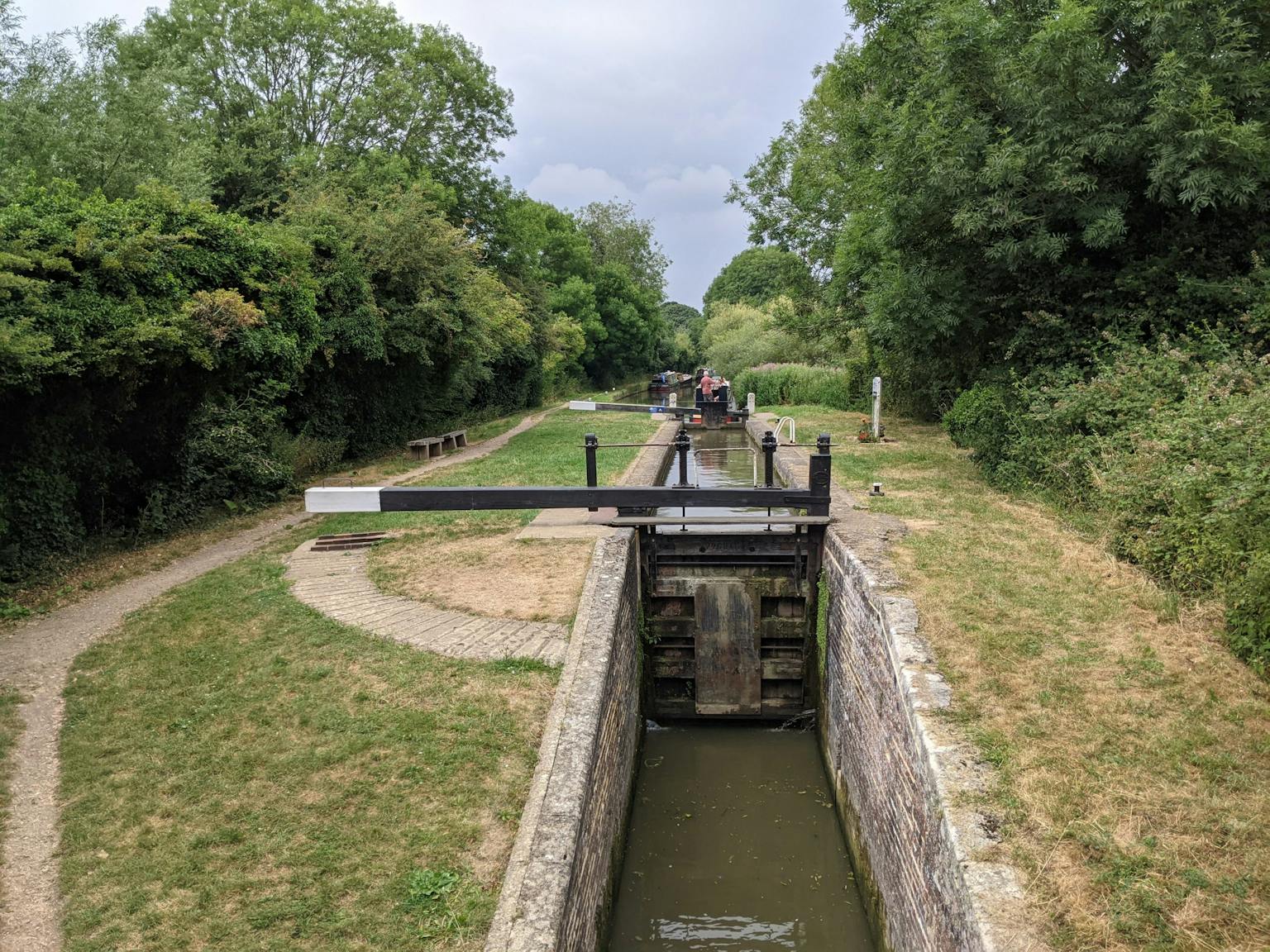 a water channel with a canal and a group of people