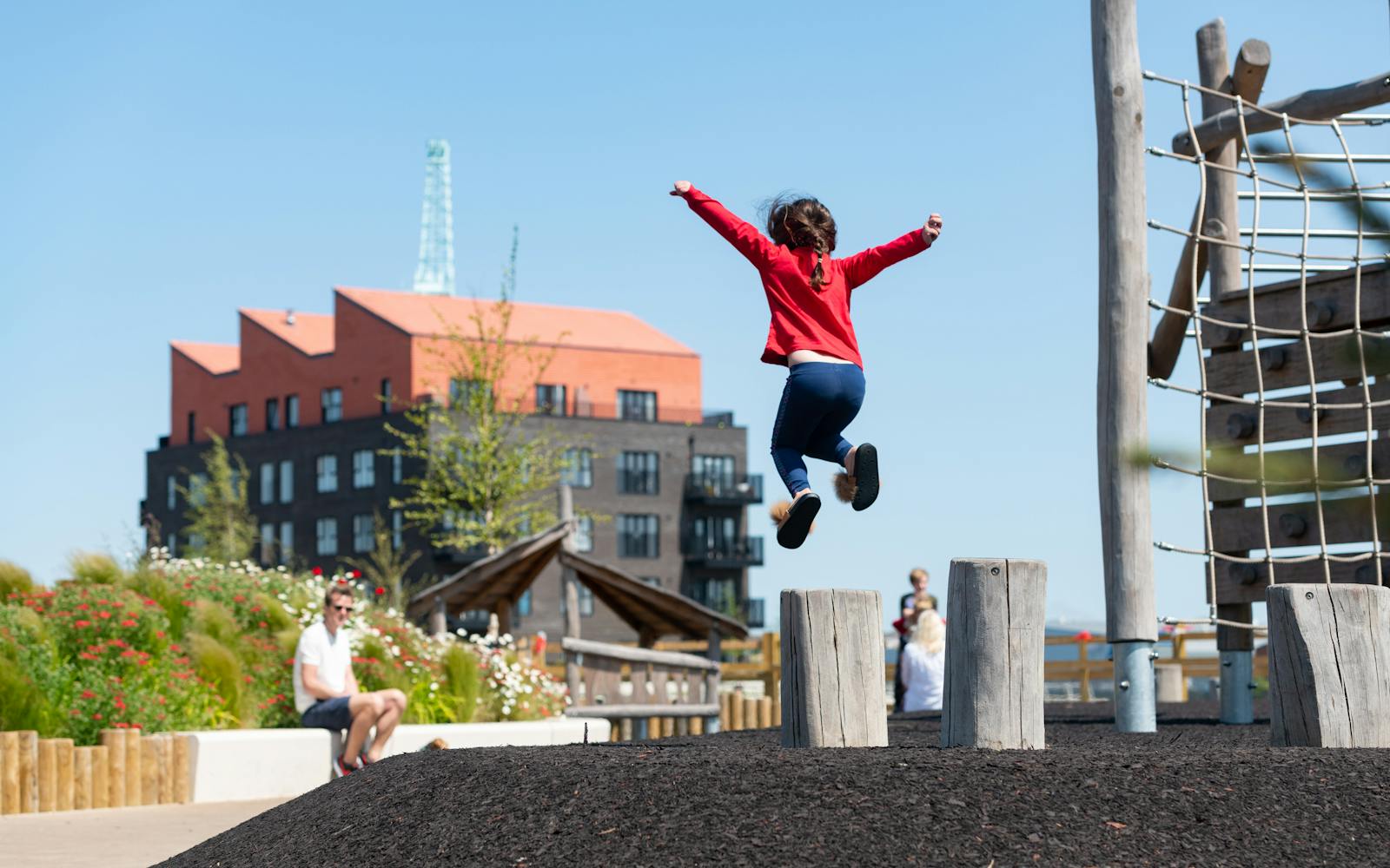 A child leaping in a playground