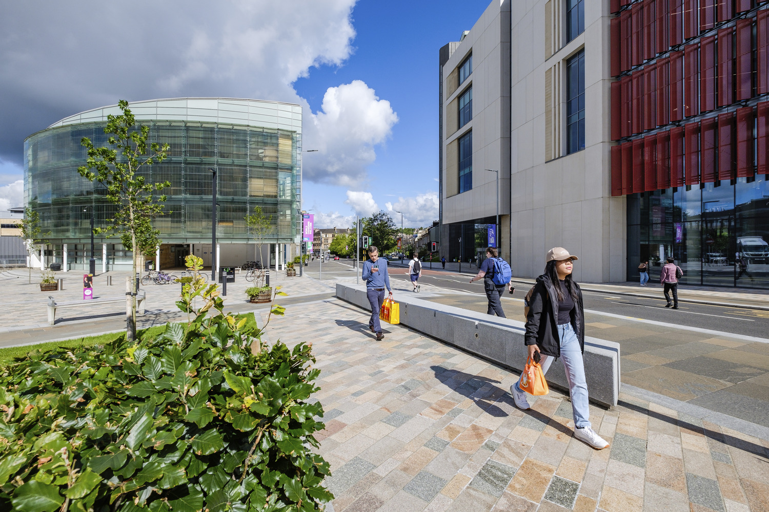 People walking in front of university buildings
