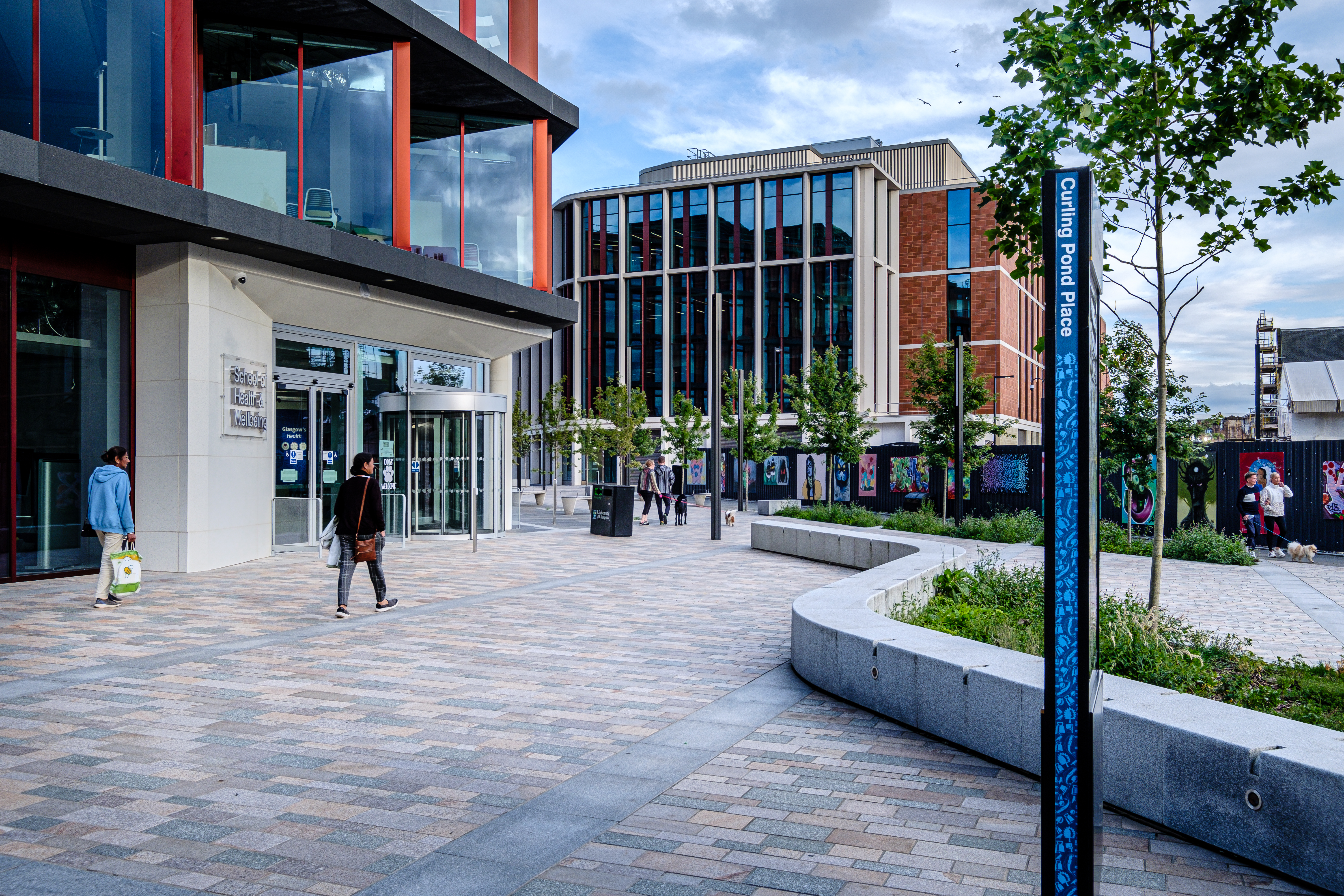 people walking on a pavement