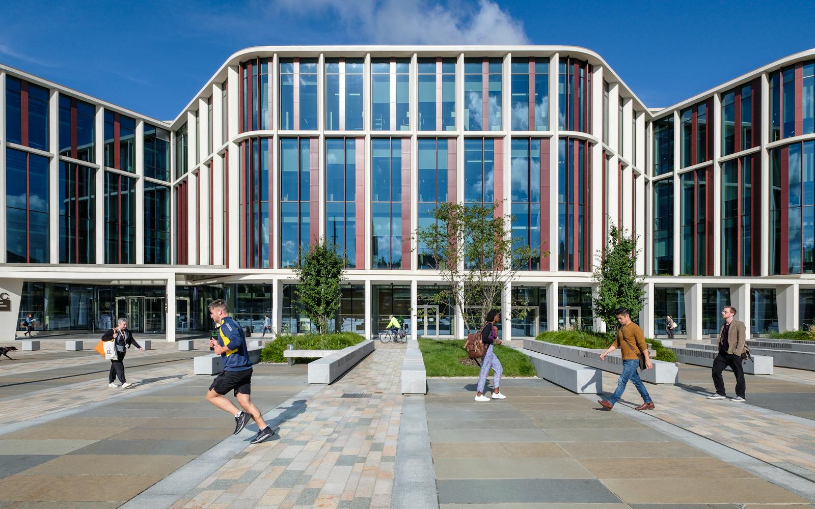 people walking in front of a building
