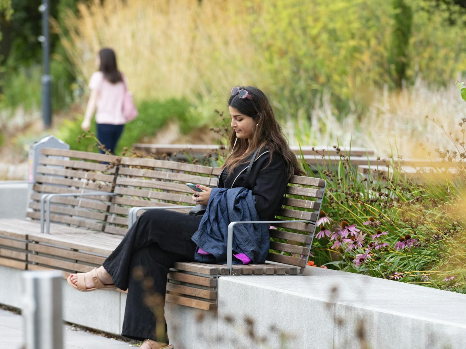 a woman sitting on a bench