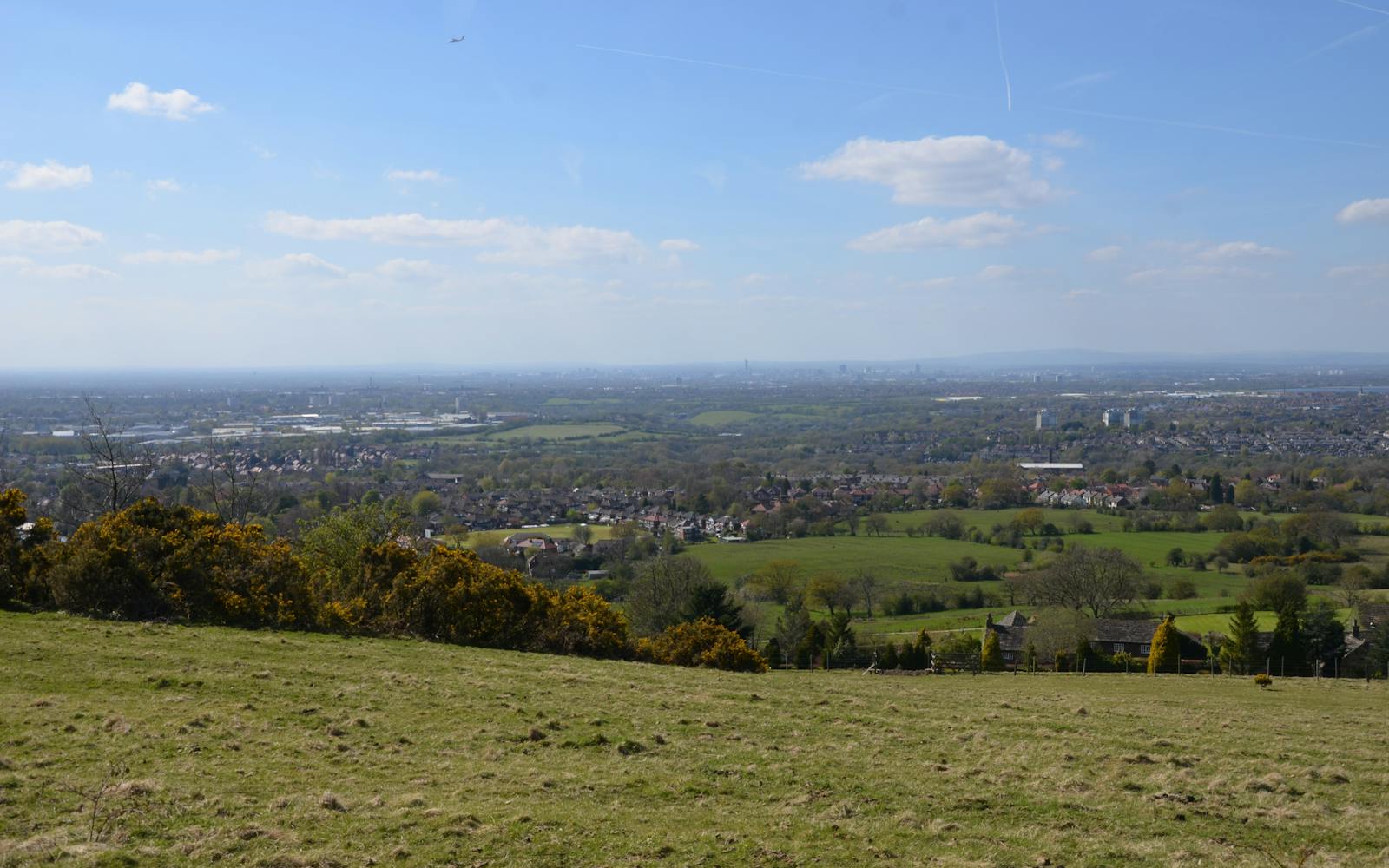a landscape with a city in the distance