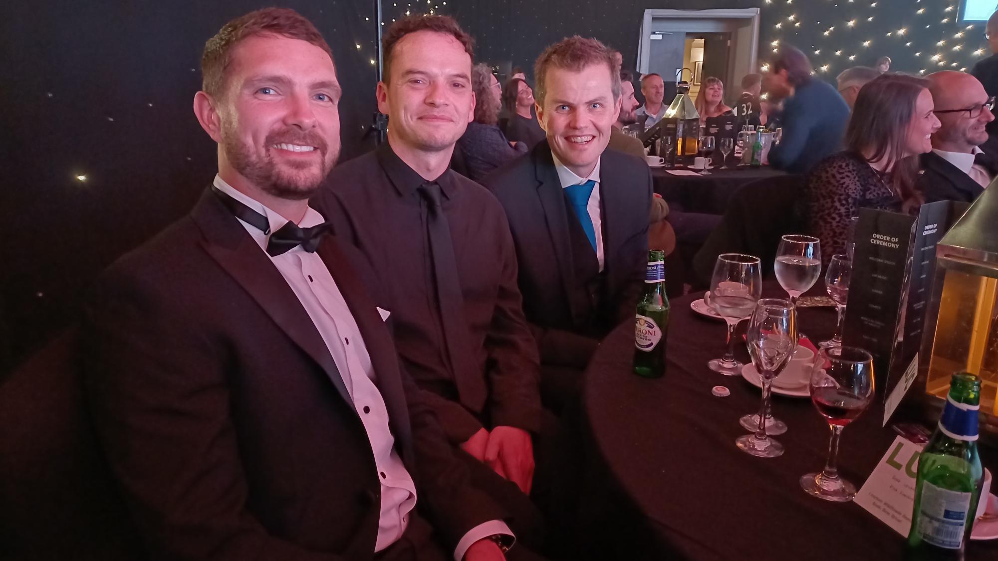 Group of people posing for photo