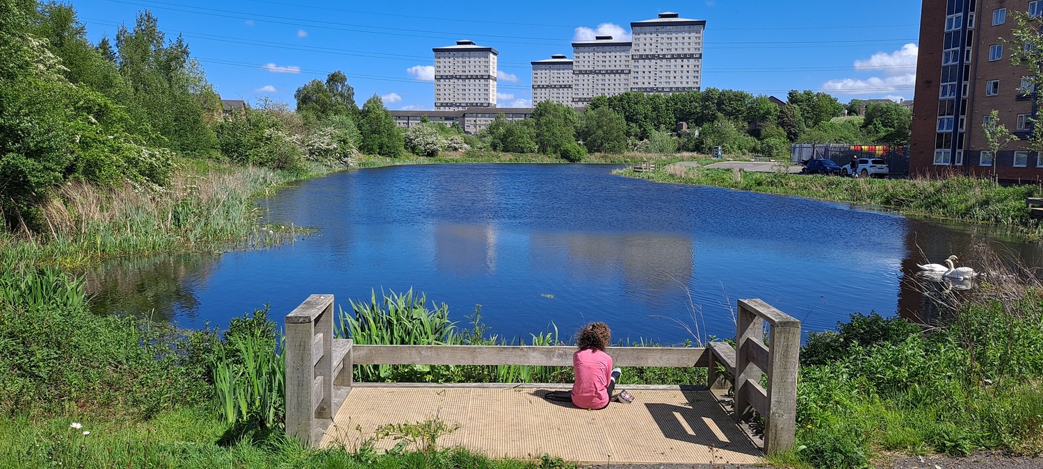 A resident from the area utilising a canal observation point within the development
