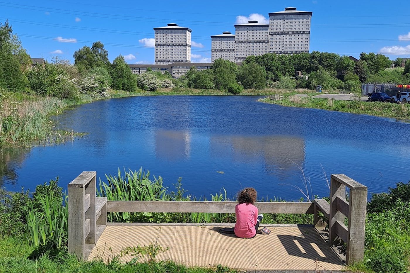 A resident from the area utilising a canal observation point within the development