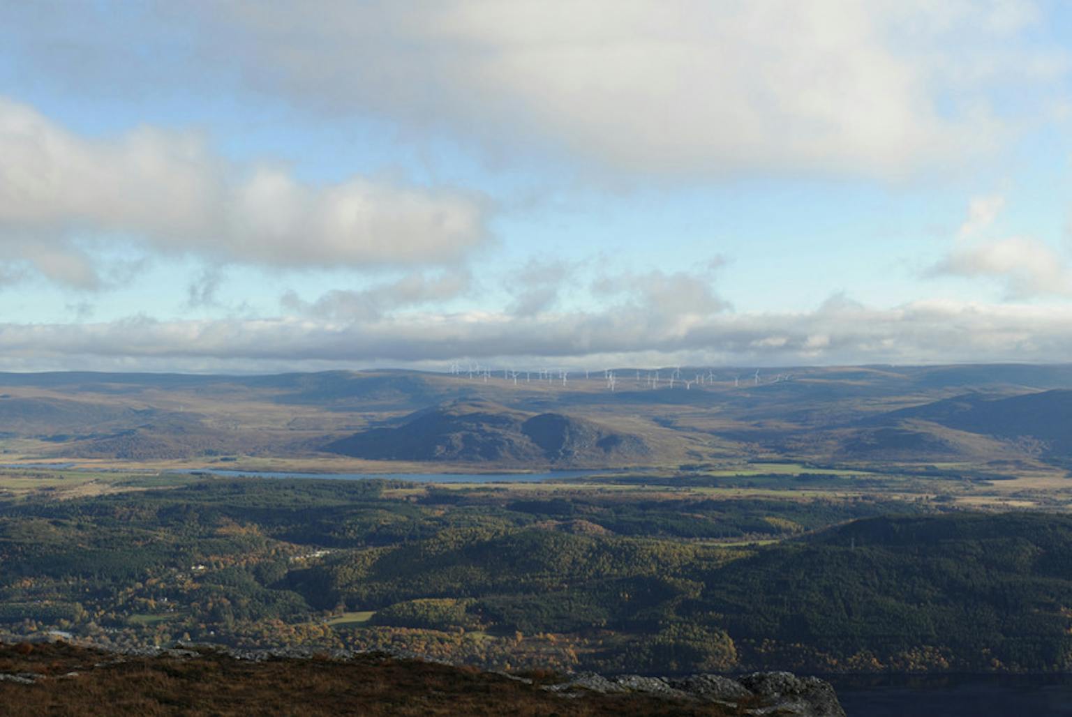 Landscape image of hills with wind farm