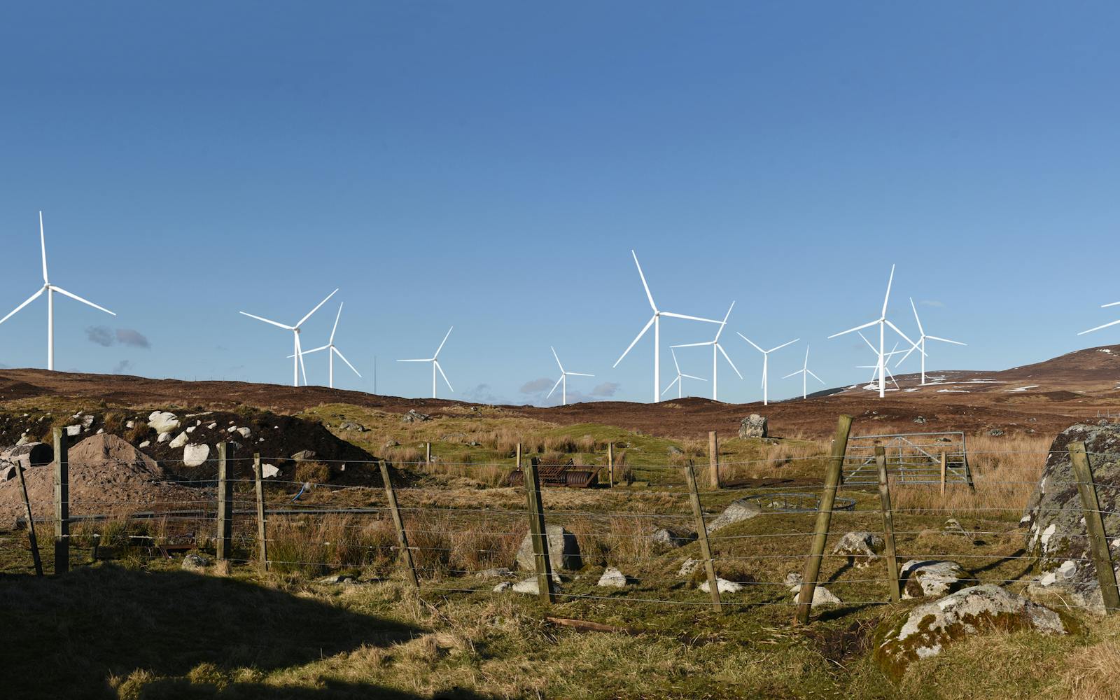 Landscape image of hills with wind farm