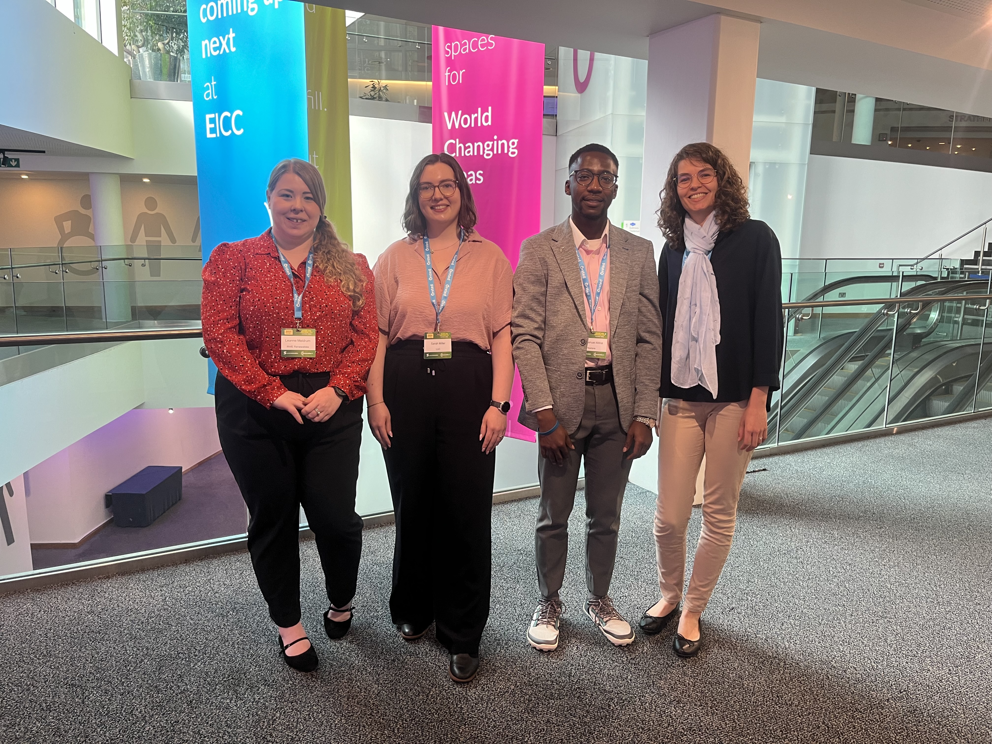 Four people standing for photo
