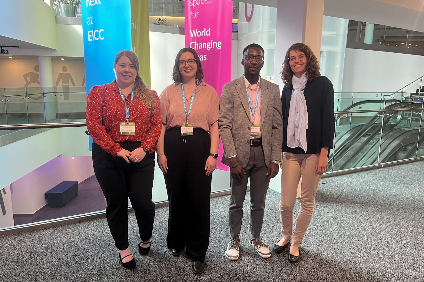 Four people standing for photo