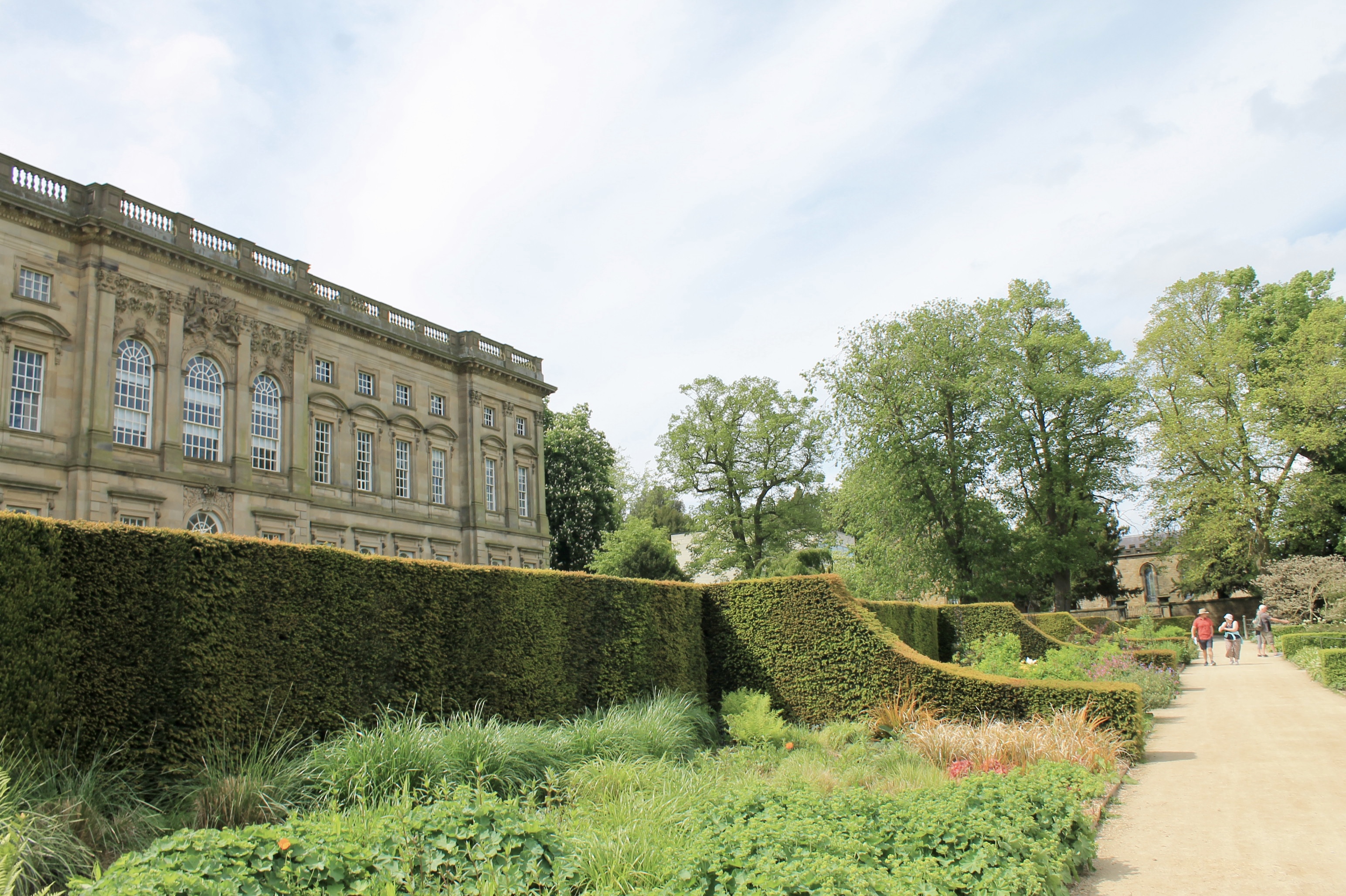 A stately house with carefully tended gardens