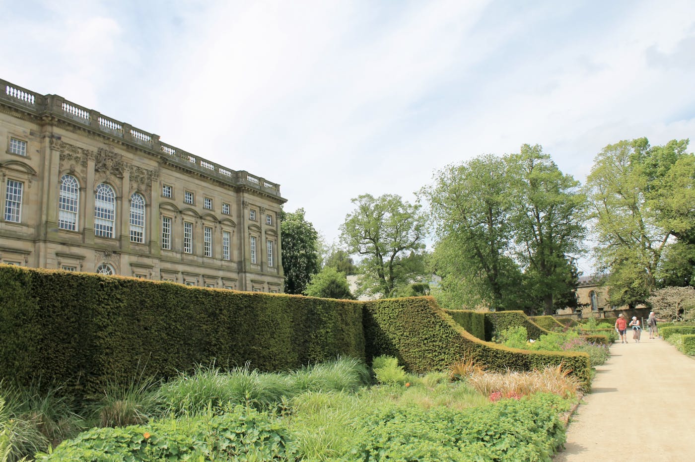 A stately house with carefully tended gardens