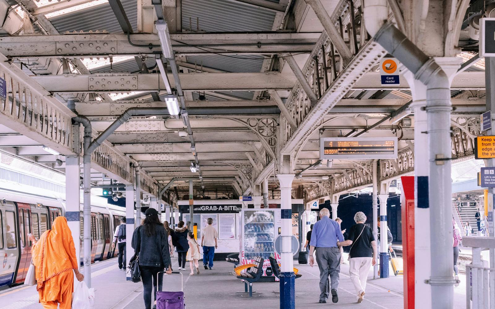 A train station with passengers on the platform