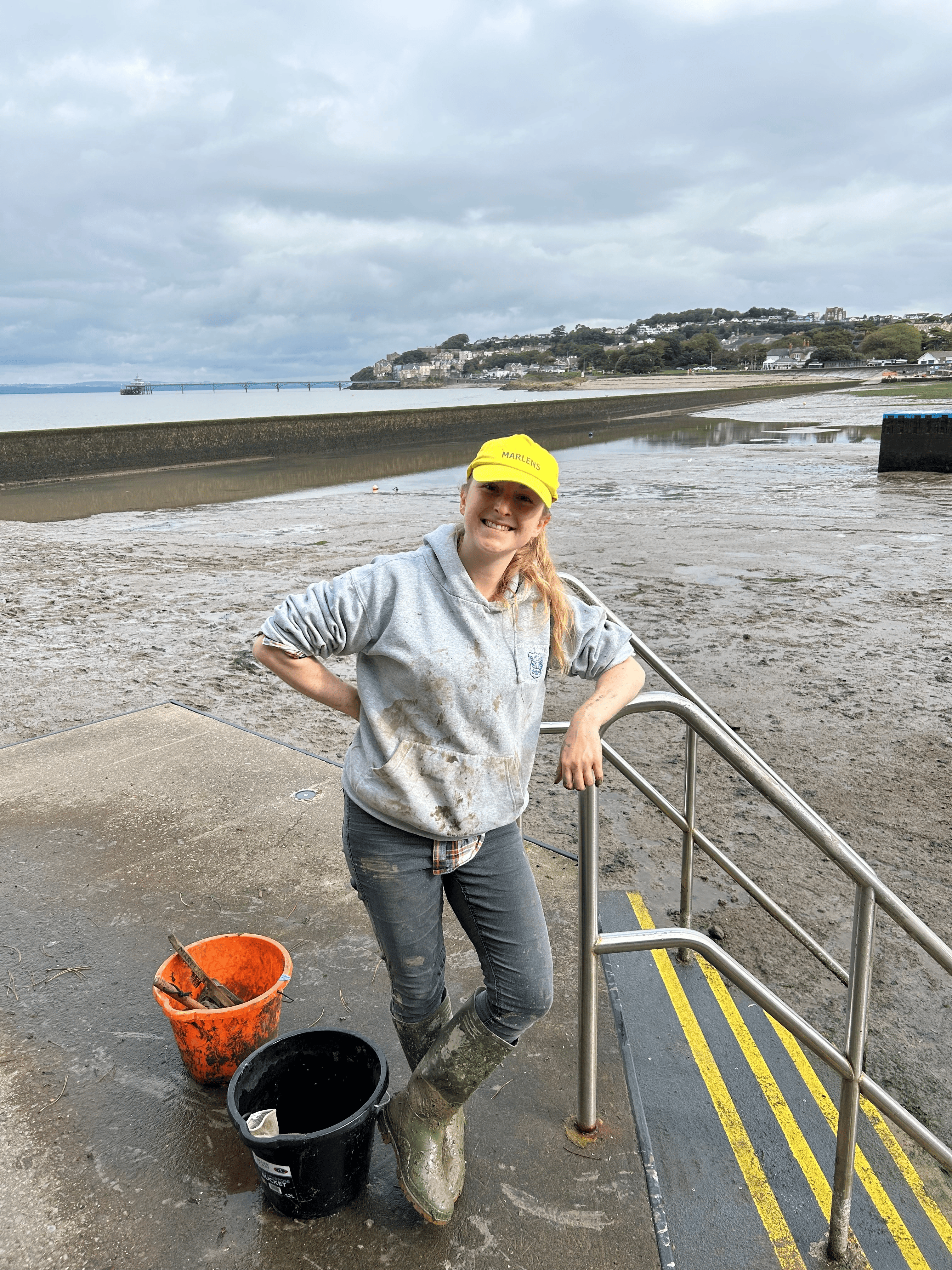 A person cleaning up a beach