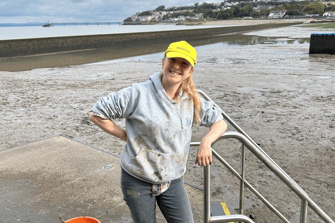 A person cleaning up a beach