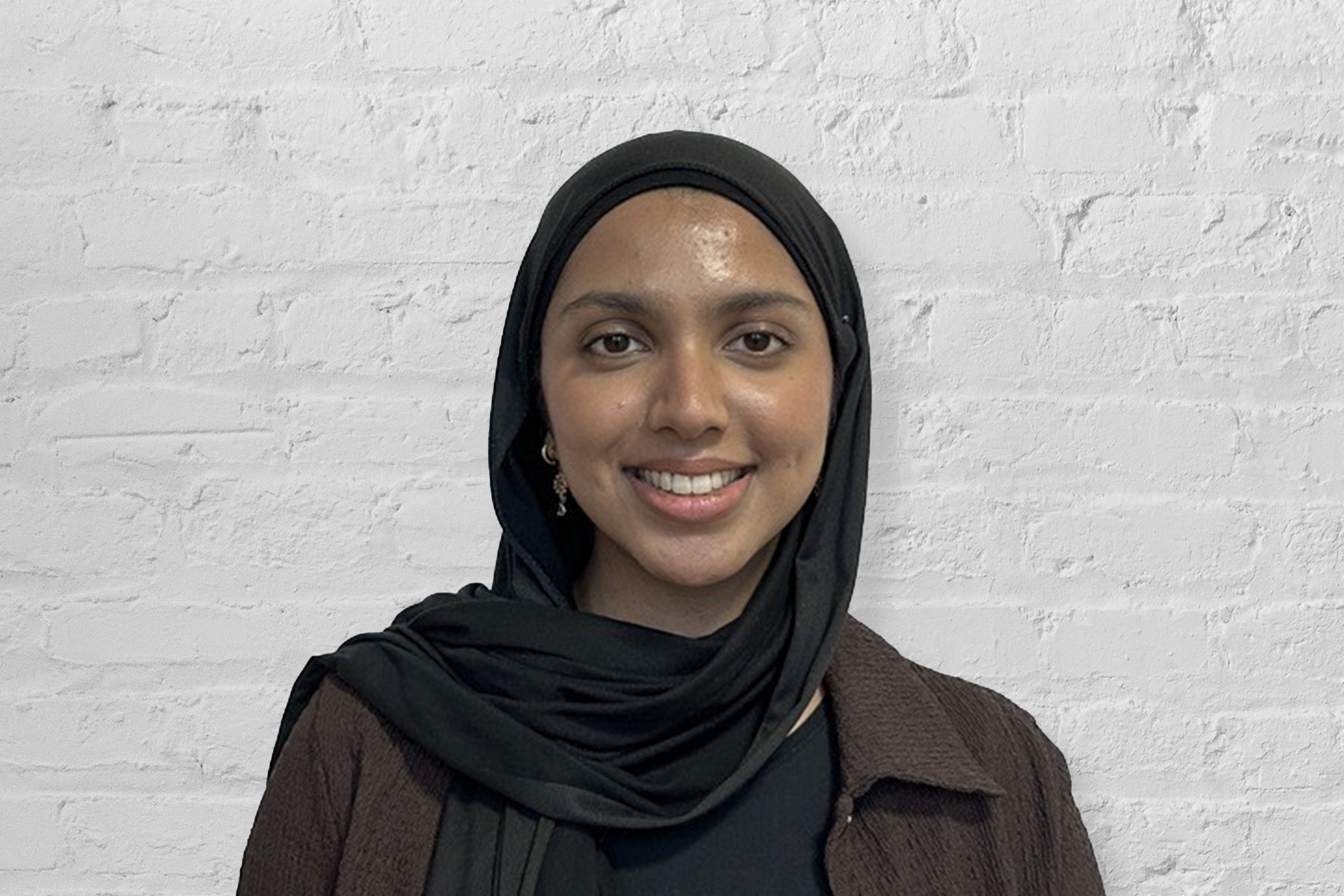 A person in front of a wall