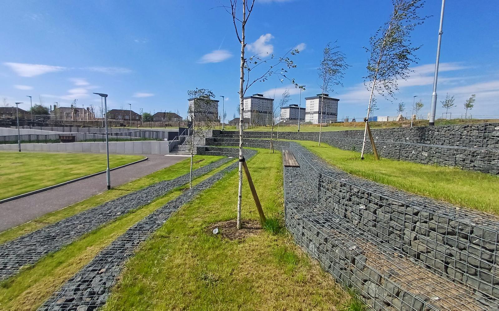 a grassy park under a clear sky