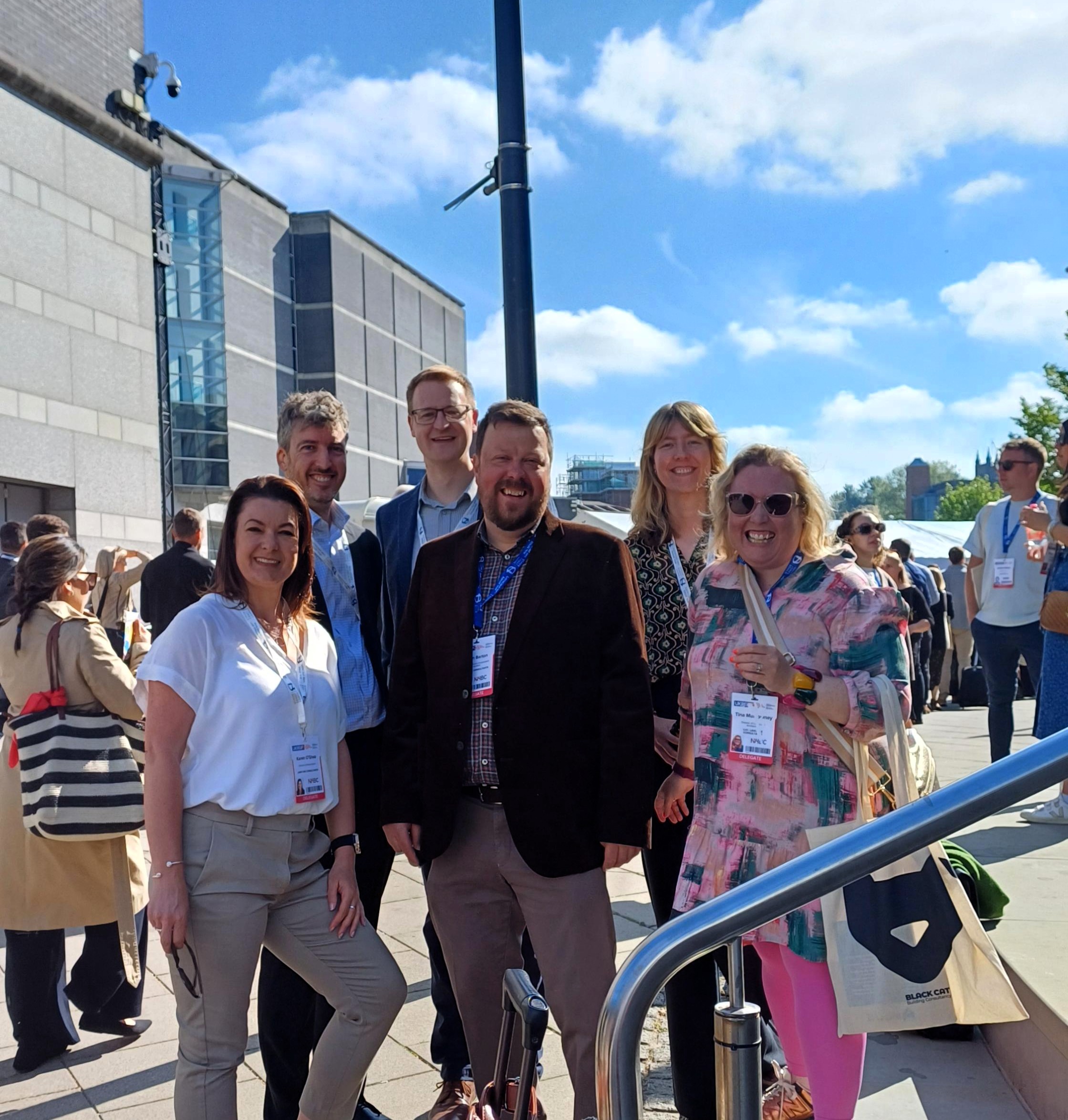 A group of people at an event smiling