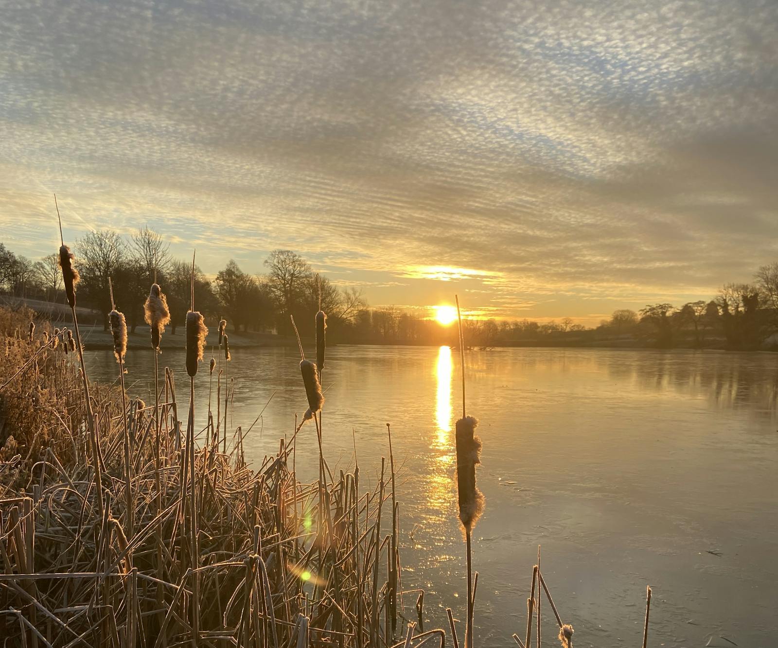 A sun setting over water