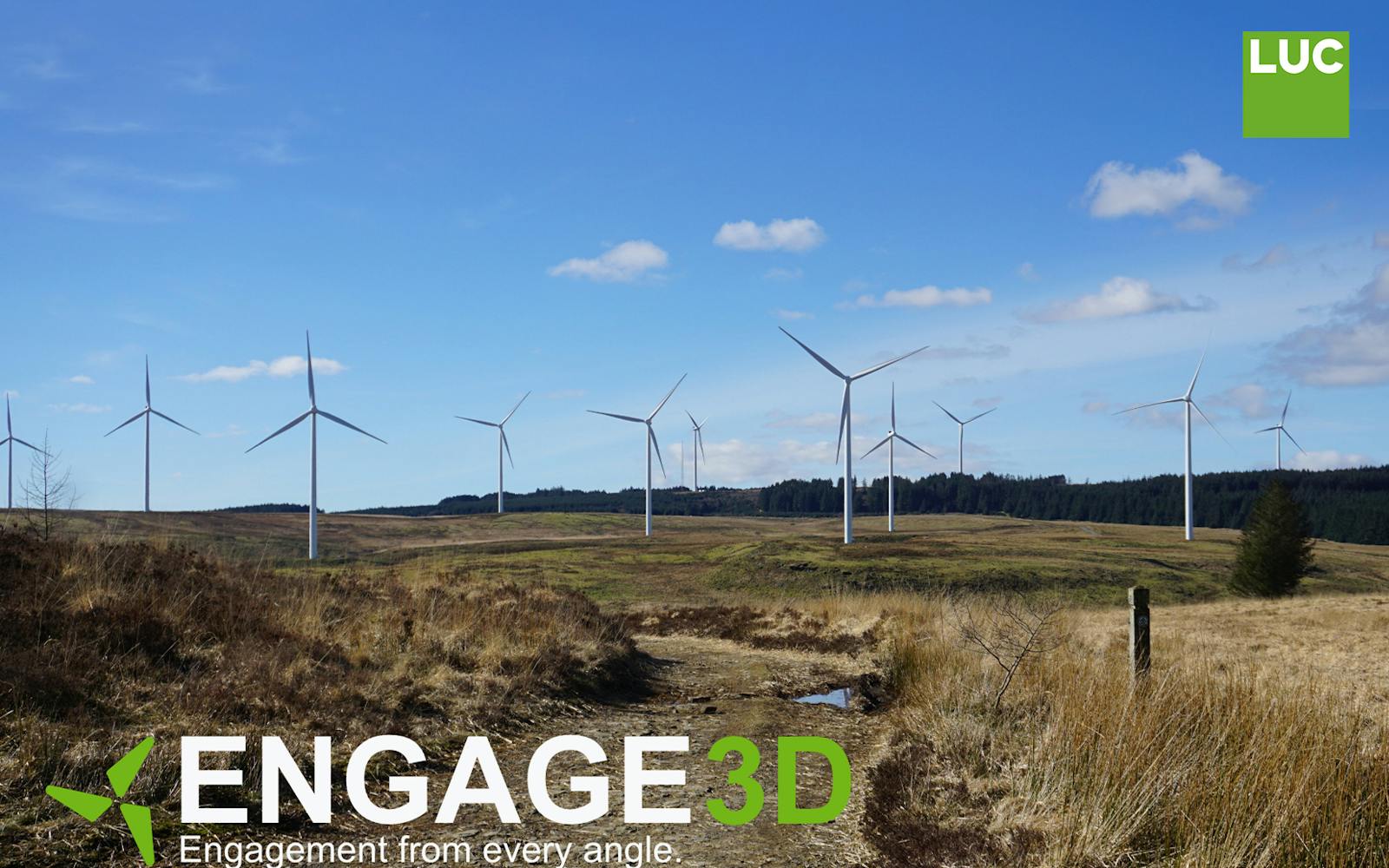 A low-angle landscape photo shows a dirt path cutting through a field of dry, grassy hills. Several large white wind turbines with rotating blades are visible in the middle ground, standing on the hills against a backdrop of dark green forest. The sky is bright blue with scattered white clouds. The words "ENGAGE 3D" are in large white font at the bottom left, with the tagline "Engagement from every angle" directly below it in smaller font. A green logo of four stylised blades rotating around a central point is to the left of the text.