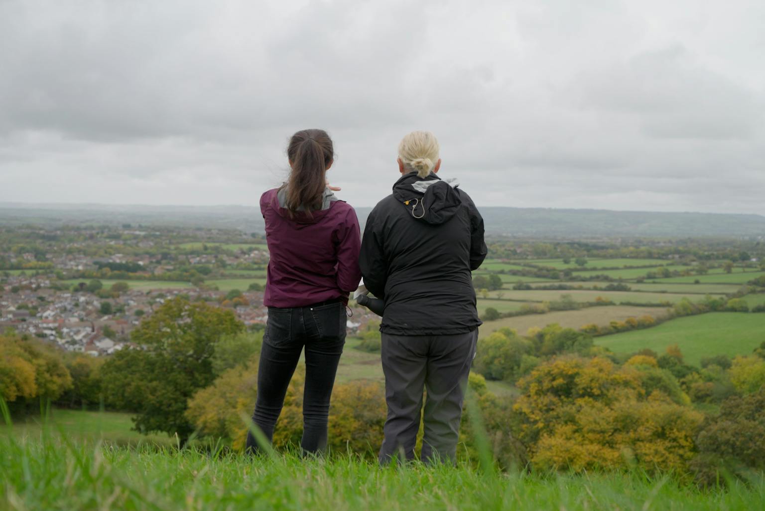 Two women looking at a landscape
