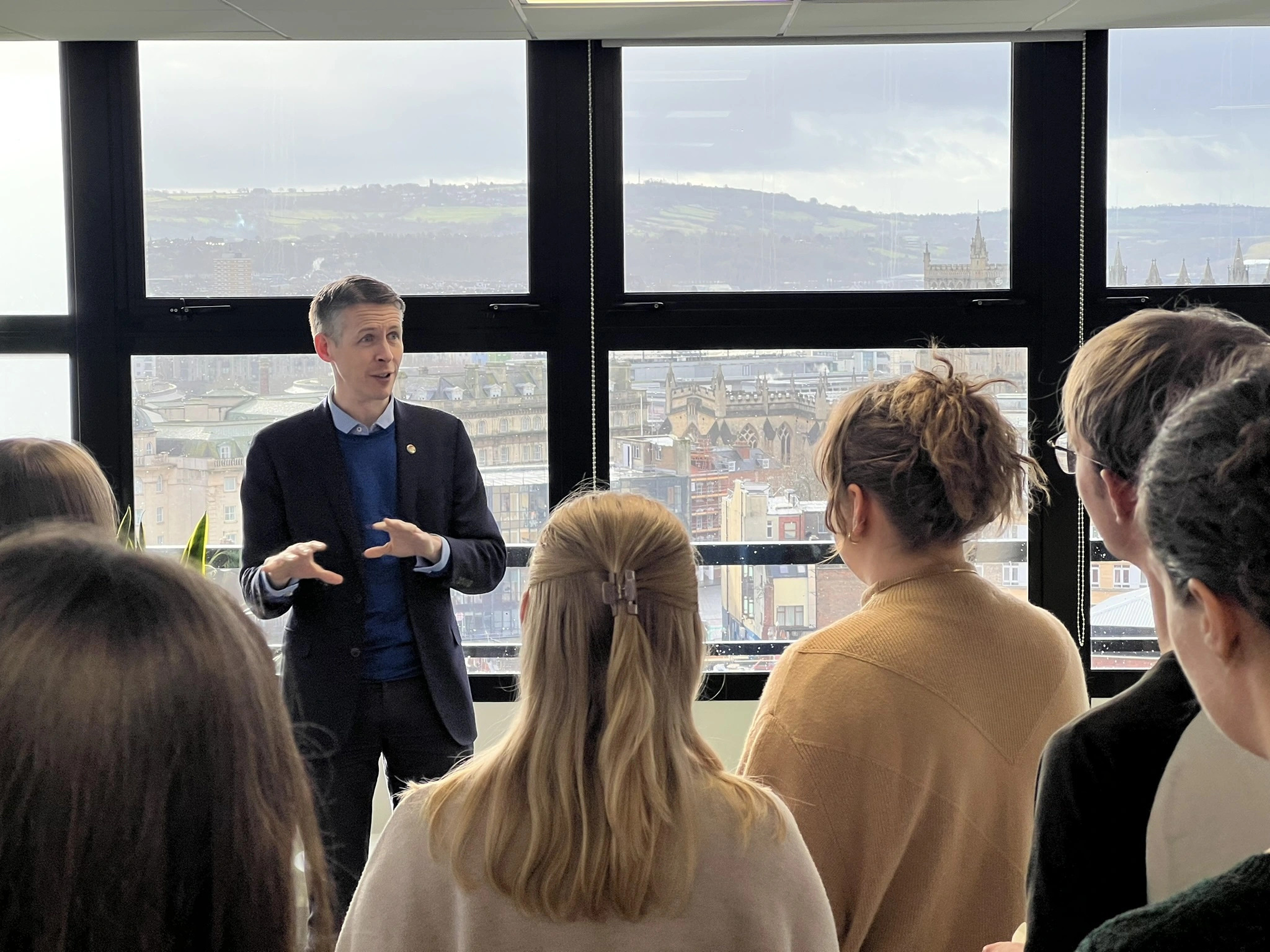 Rob Booth speaking to a crowd of people