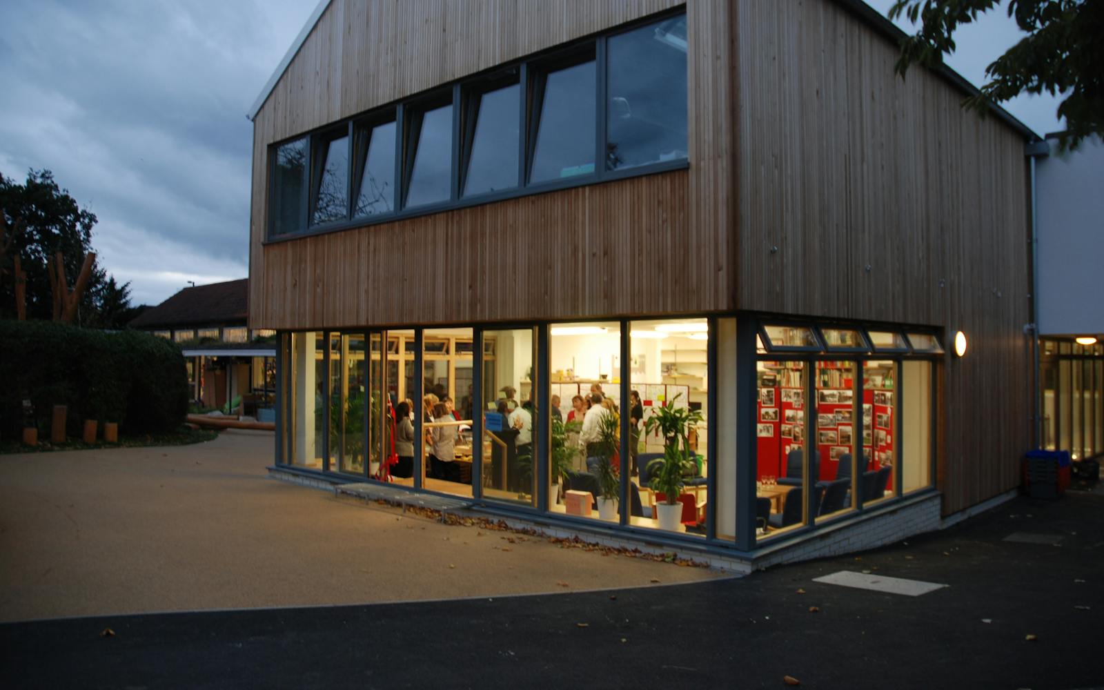 A modern library building with people inside