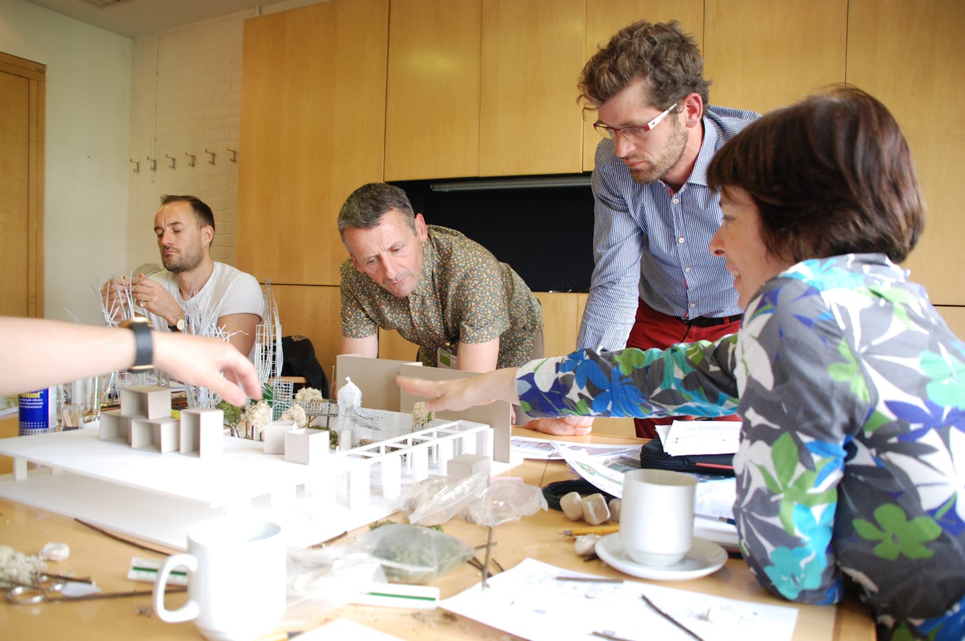 People making models with paper