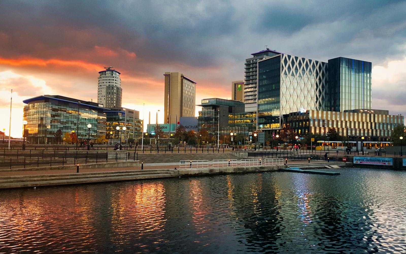 Large office buildings and river at sunset