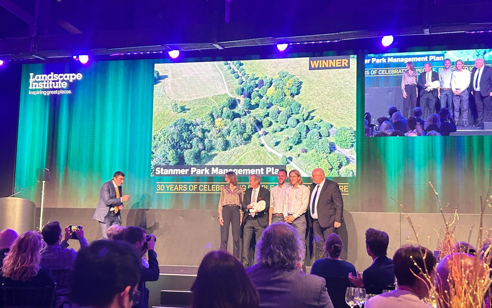 Picture of Kate Milner, Rob Dumbrill, Matt Parkhill and Ben Shakespeare on the stage accepting the LI Award for Landscape and Parks Management