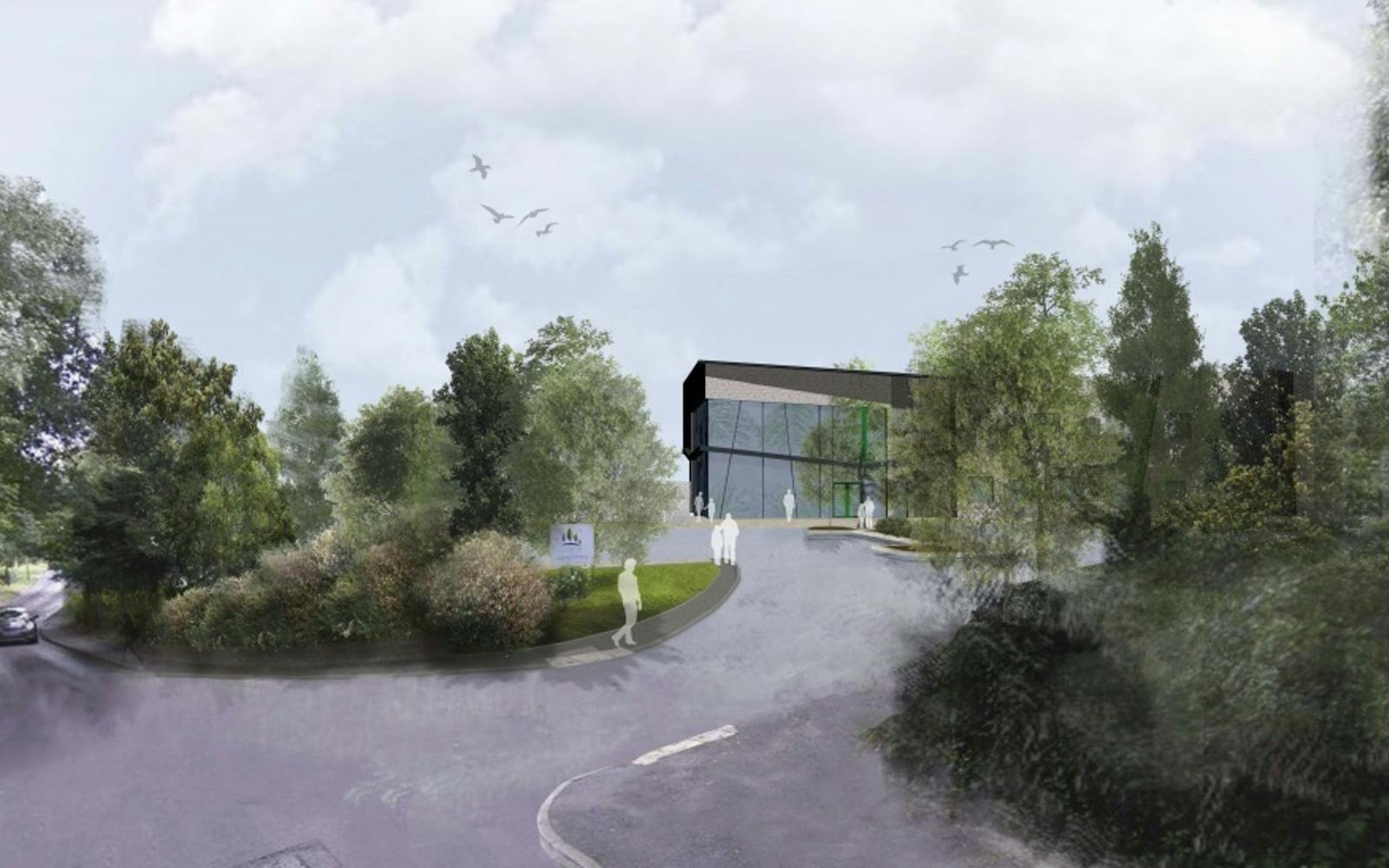 a building with trees and a road