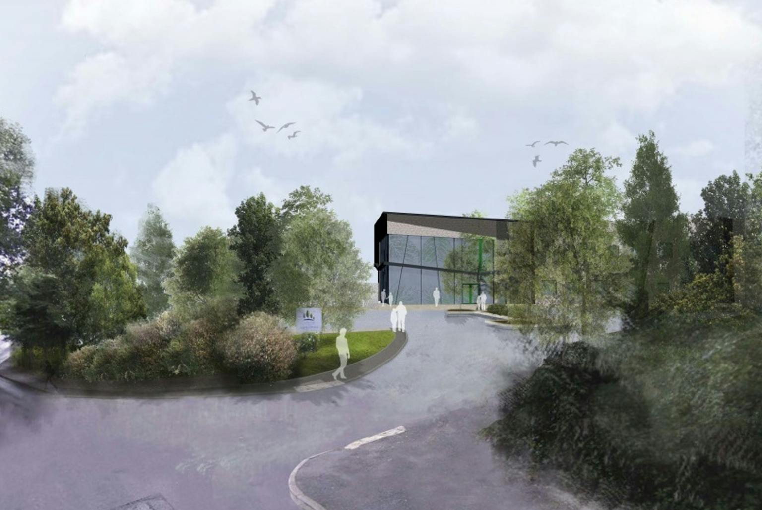 a building with trees and a road