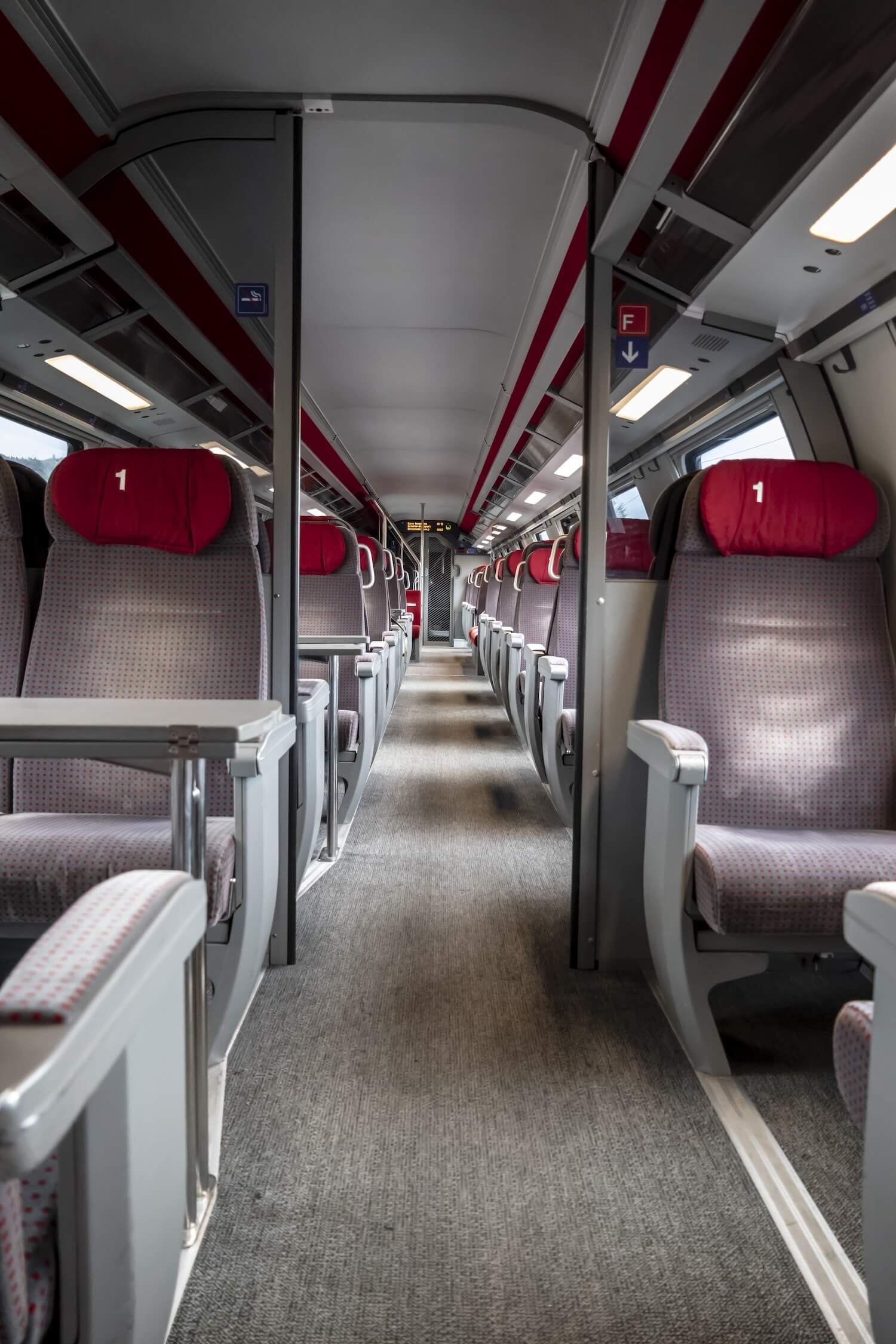 Interior of a train with a carpeted floor using graphite-based backing
