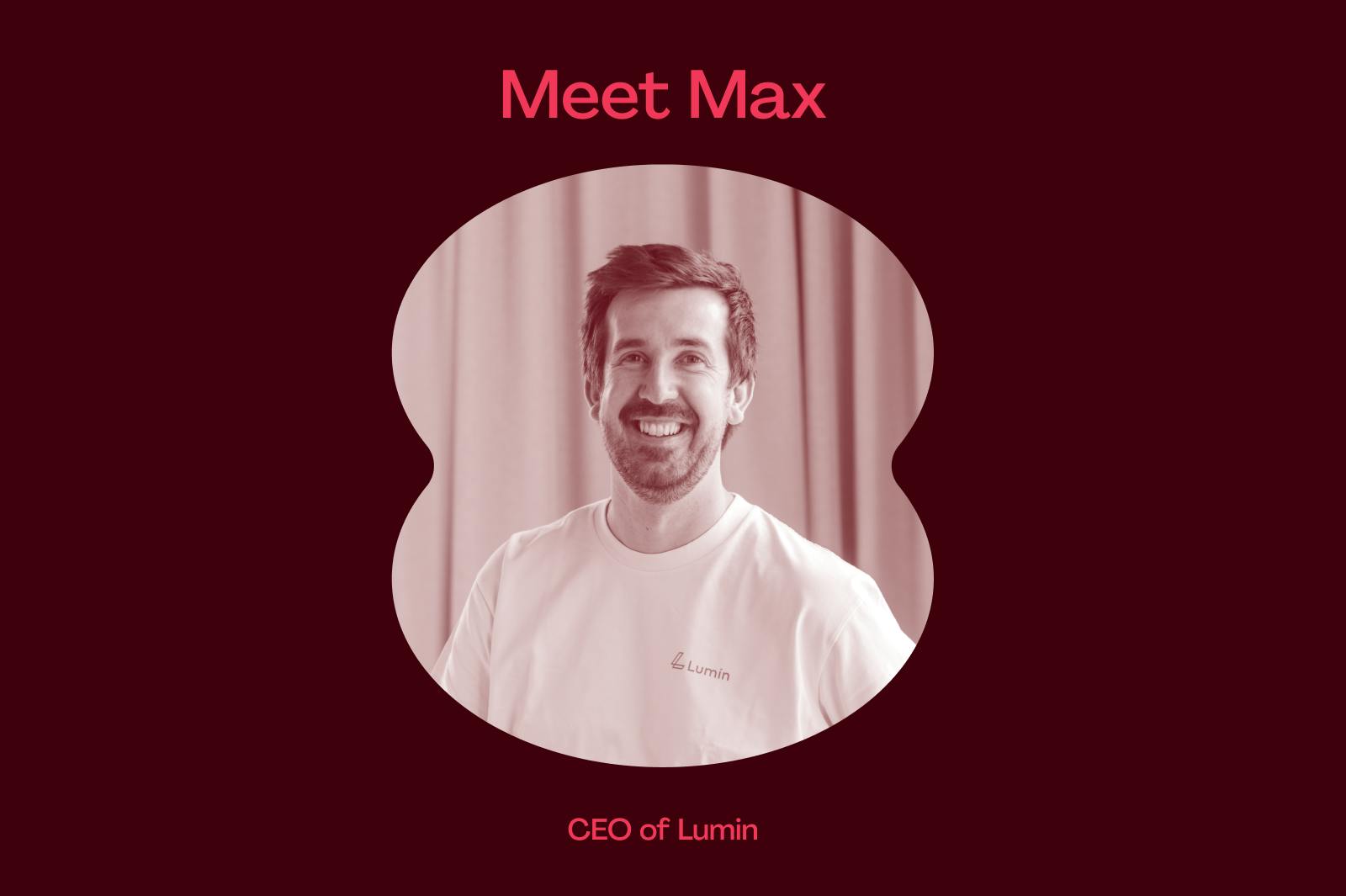 Max - a white man with short brown hair, facial scruff and a big smile - faces the camera. he is wearing a white t-shirt with the Lumin logo on it on the right breast.