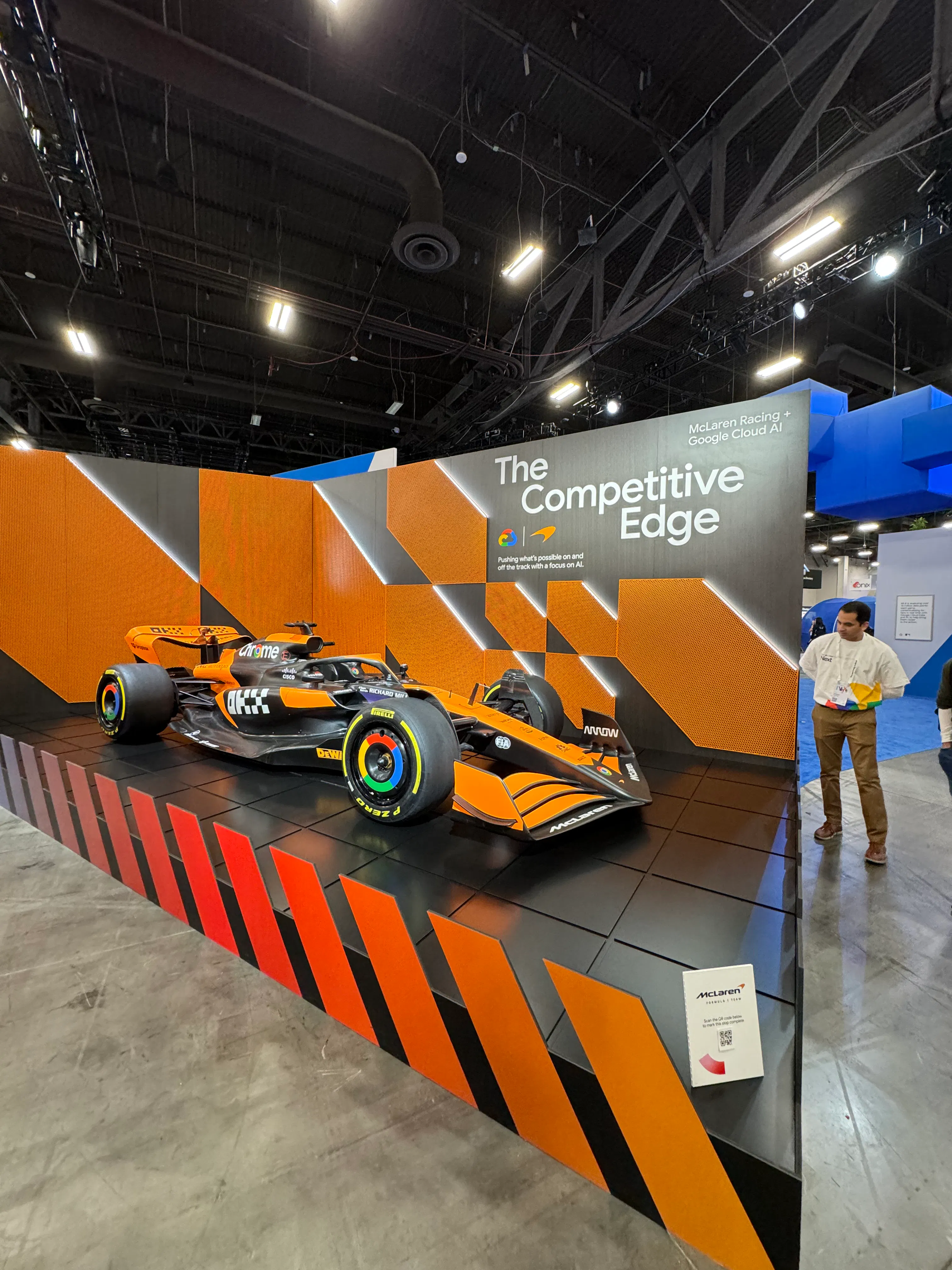 an orange and black mclaren car at google next