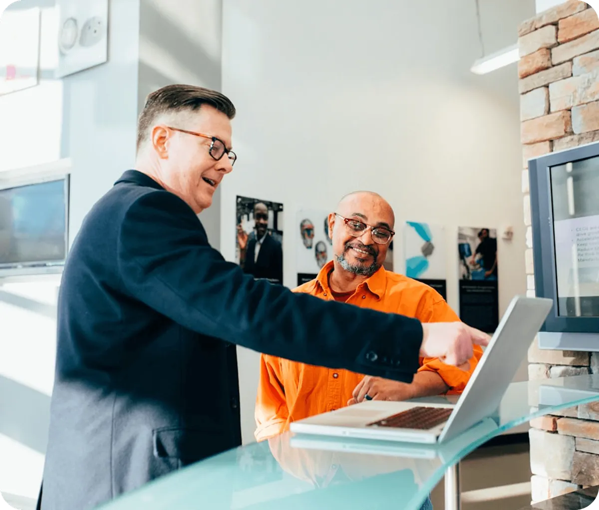 A business owner giving a presentation on laptop