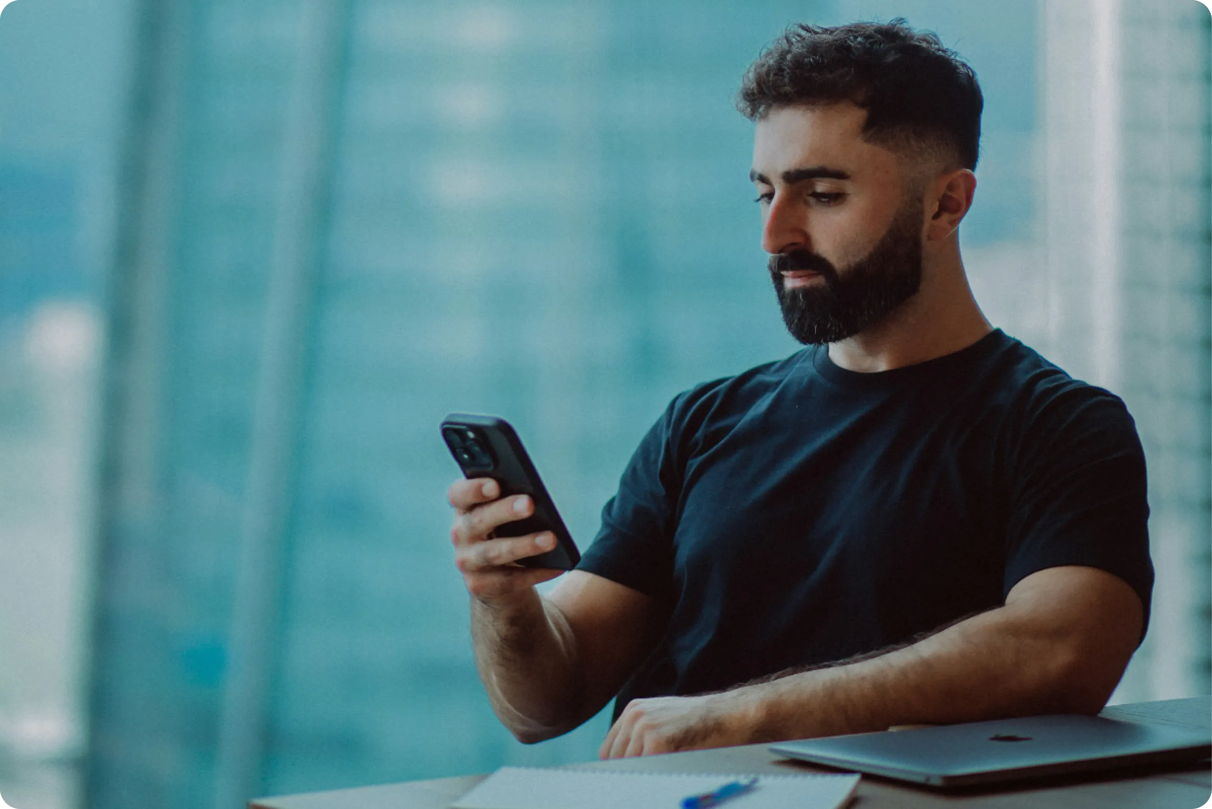 Image of a man completing a survey on his phone
