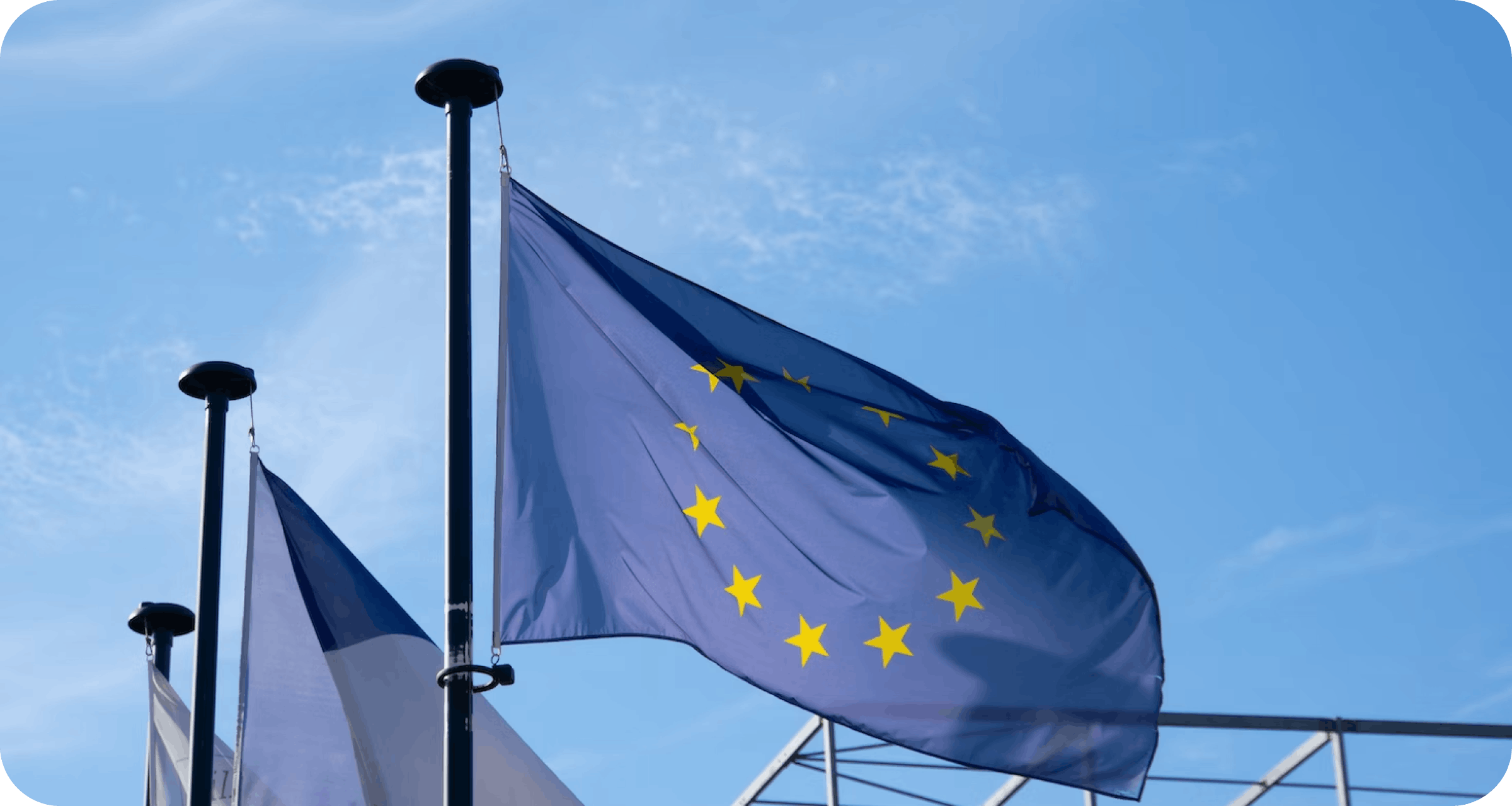 Photo of the EU flag with a background of blue sky