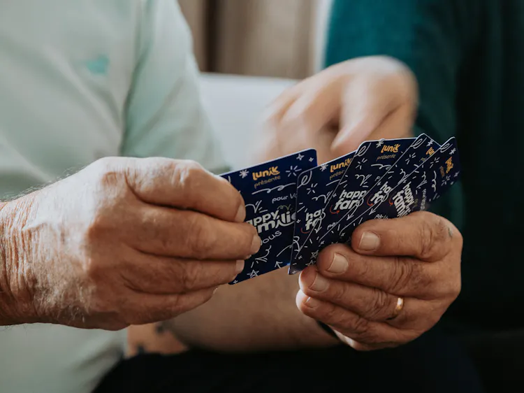 A personalized game of Happy Families played with family around a table