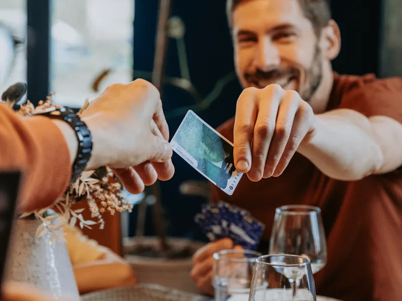 Family playing a personalized card game together