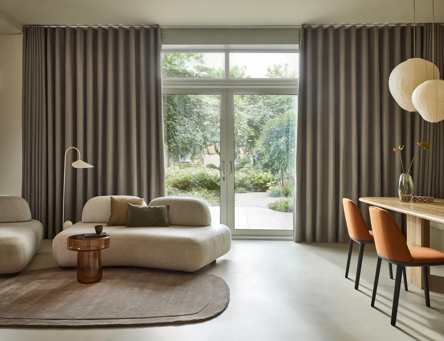 Dark green curtains in a modern living and dining room