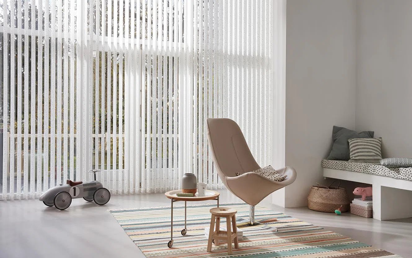 Light room with white Vertical blinds on large windows 